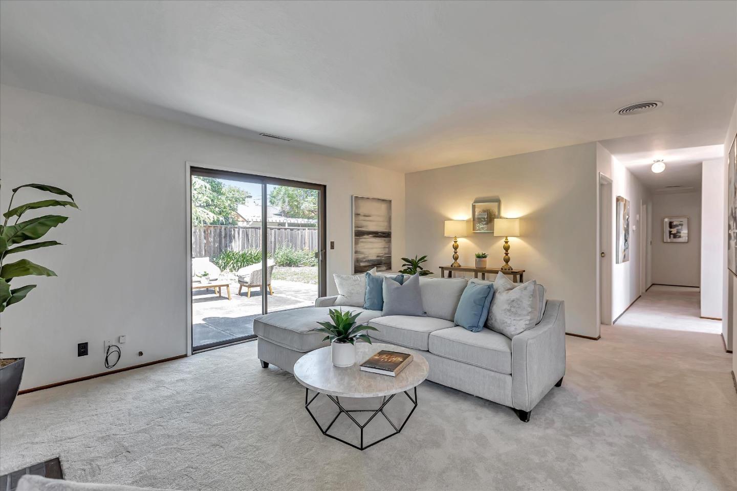 126 Brian Lane Santa Clara, CA 95051 - Photo 5 of 21 a living room with furniture and a large window