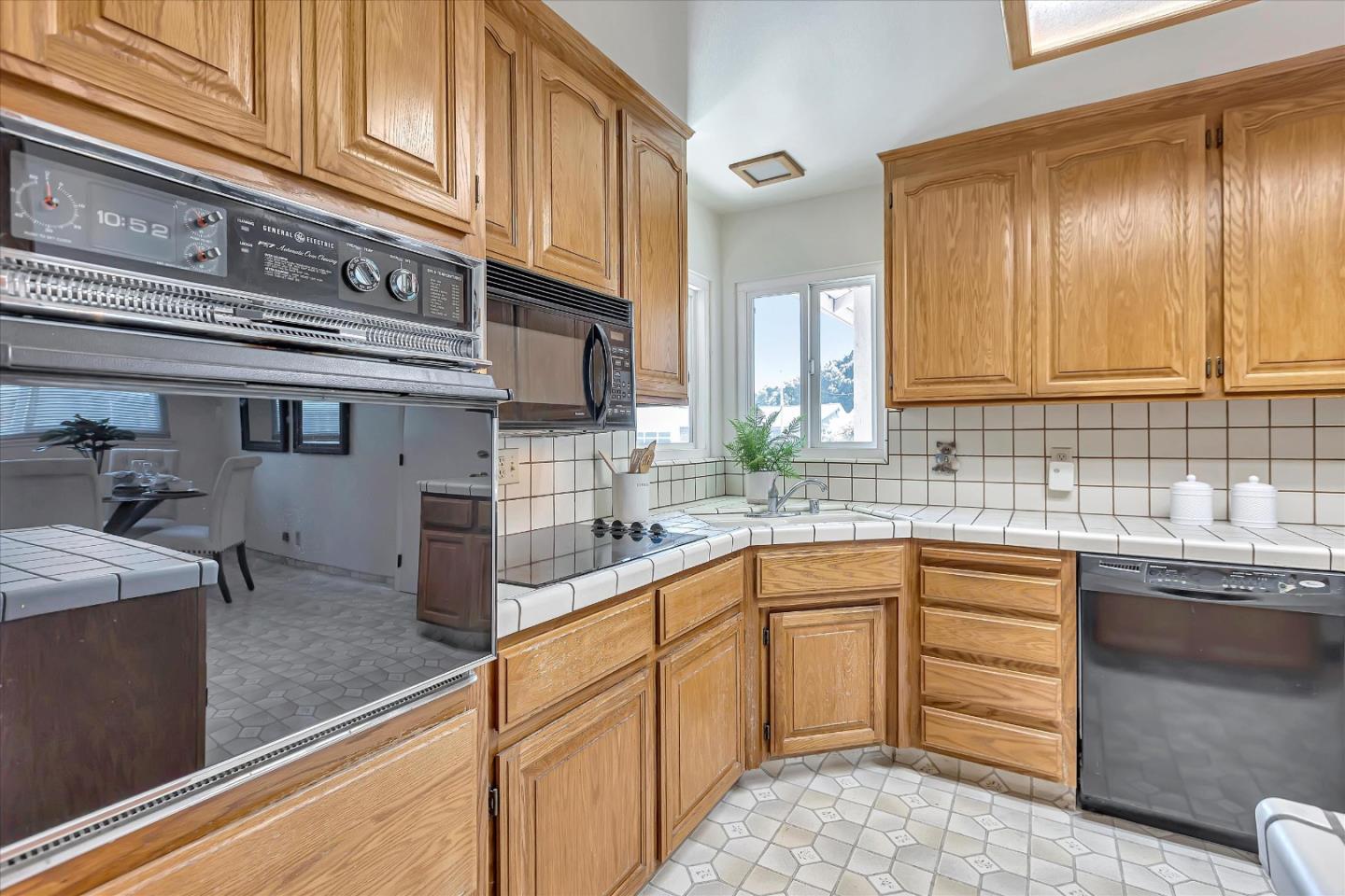 126 Brian Lane Santa Clara, CA 95051 - Photo 9 of 21 a kitchen with stainless steel appliances granite countertop a sink and cabinets
