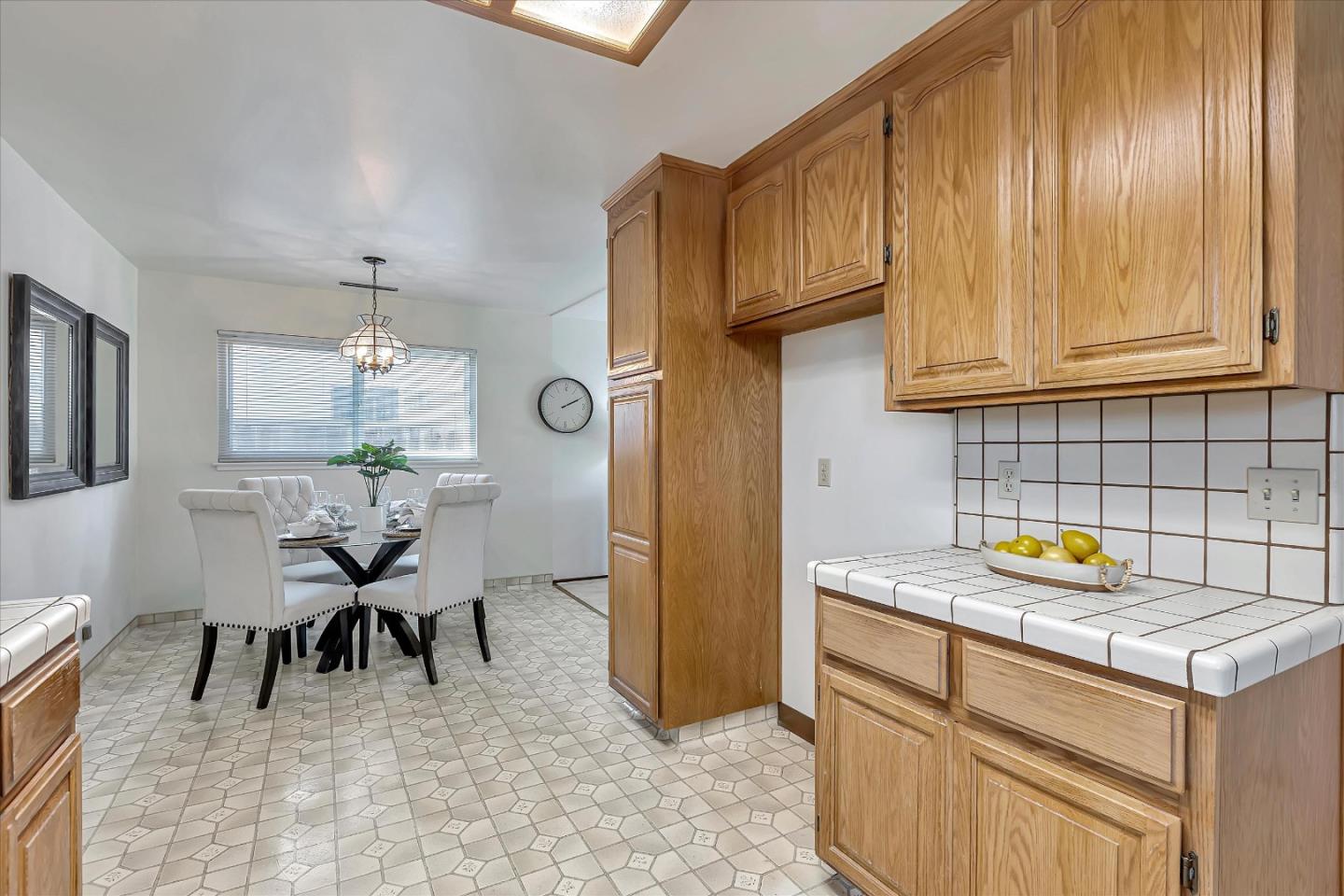 126 Brian Lane Santa Clara, CA 95051 - Photo 10 of 21 a kitchen with a sink cabinets and dining table