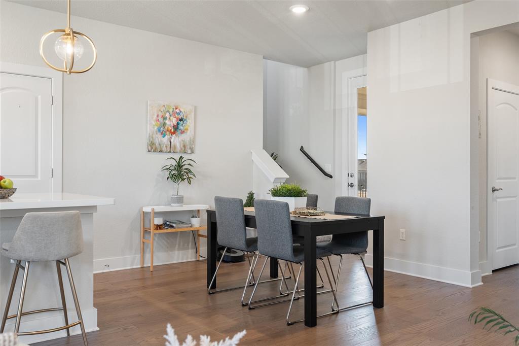 8419 Laughlin Lane Austin, TX 78744 - Photo 11 of 40 Dining area with dark wood-style flooring and recessed lighting