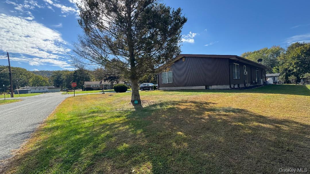9 Carpenter Road Port Jervis, NY 12771 - Photo 3 of 17 a view of a swimming pool with an outdoor space and seating area