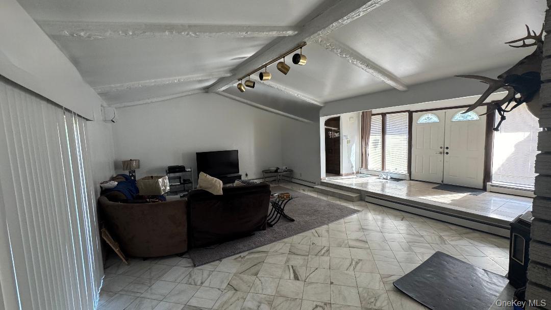 9 Carpenter Road Port Jervis, NY 12771 - Photo 9 of 17 a living room with furniture and a flat screen tv