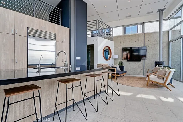 a kitchen with stainless steel appliances granite countertop a sink and a counter