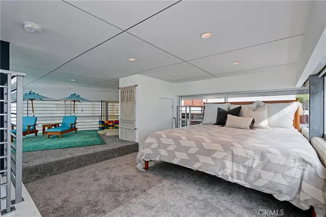 a bedroom with two beds and a window