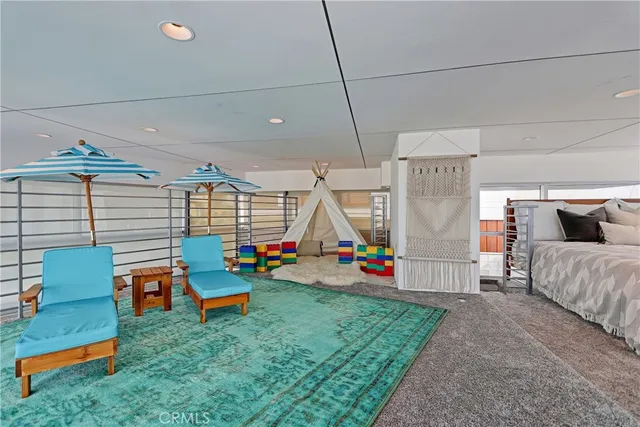 a backyard of a house with outdoor seating