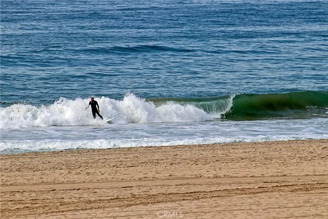 a view of a patio with table and chairs under an umbrella