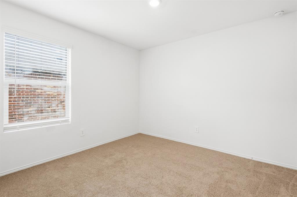 2604 Spring Time Drive Ennis, TX 75119 - Photo 6 of 21 an empty room with a window