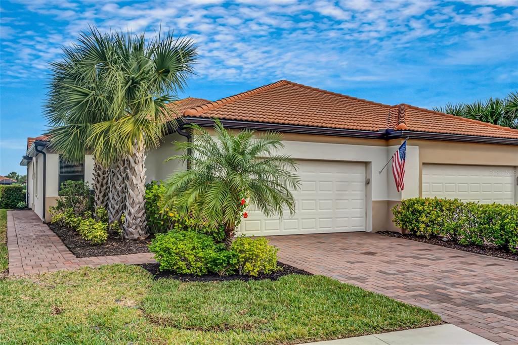 9852 Haze Drive Venice, FL 34292 - Photo 1 of 1 a front view of a house with garden