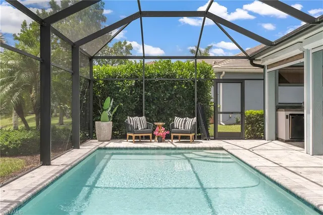 a view of a dining room with furniture and a window
