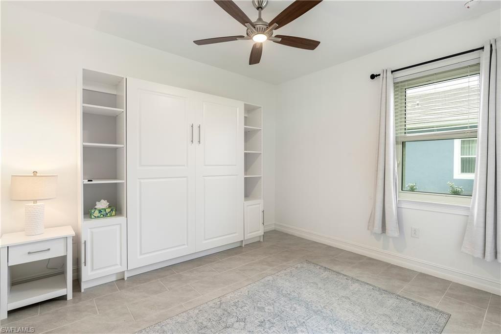 14837 Windward Lane Naples, FL 34114 - Photo 18 of 39 an empty room with closet