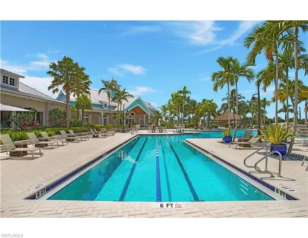 an aerial view of a house with a swimming pool