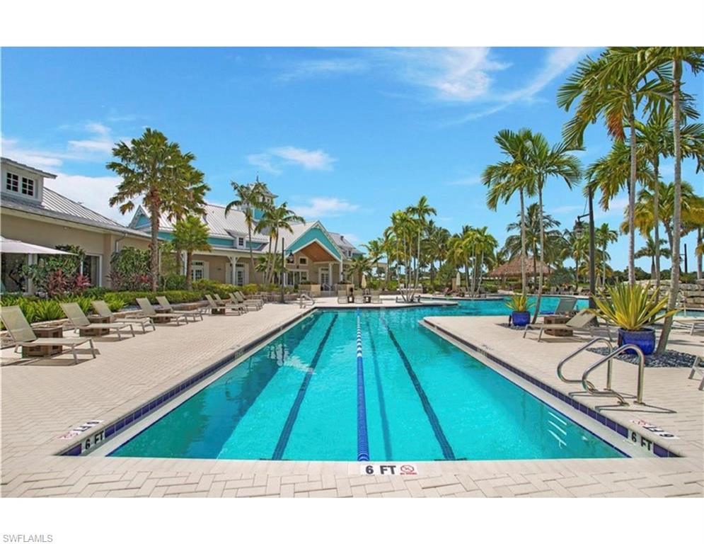 14837 Windward Lane Naples, FL 34114 - Photo 30 of 39 a swimming pool with chairs