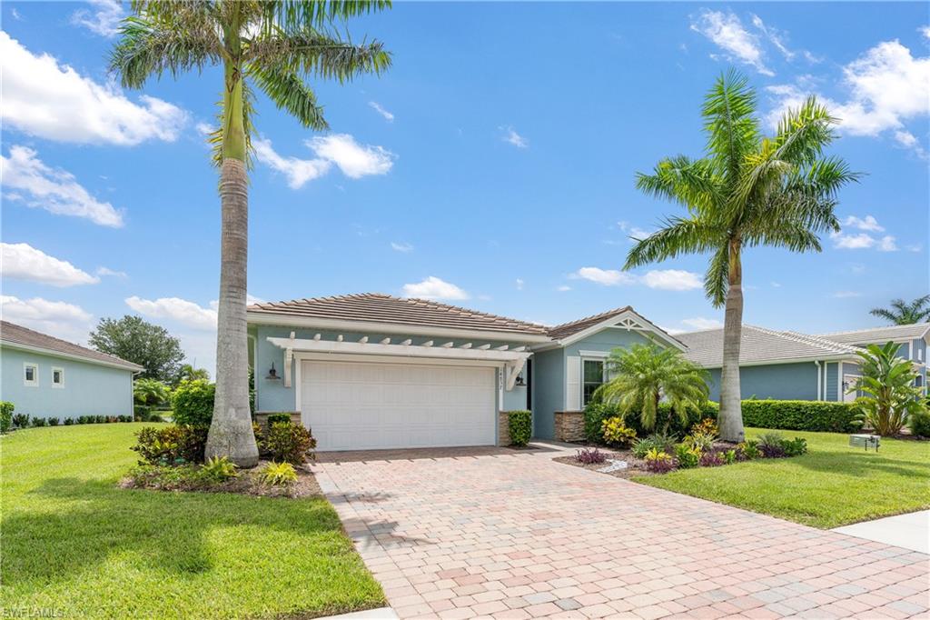 14837 Windward Lane Naples, FL 34114 - Photo 39 of 39 a front view of a house with garden
