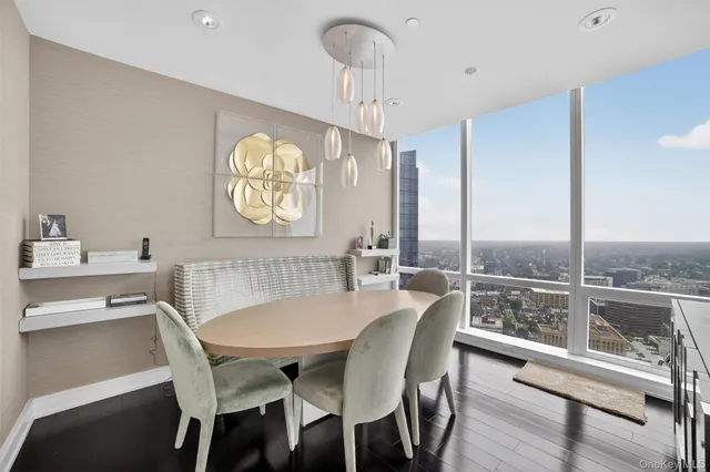 a view of a dining room with furniture window and wooden floor