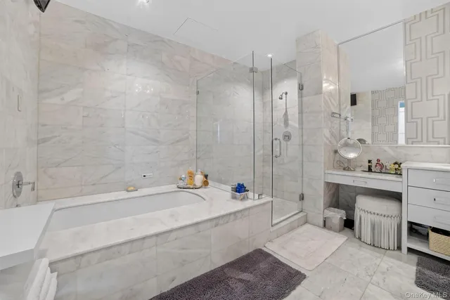 a bathroom with a bathtub shower sink and toilet