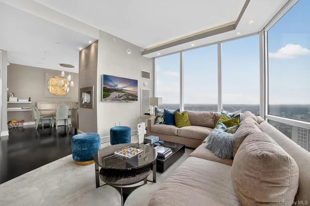 a living room with furniture and a large window