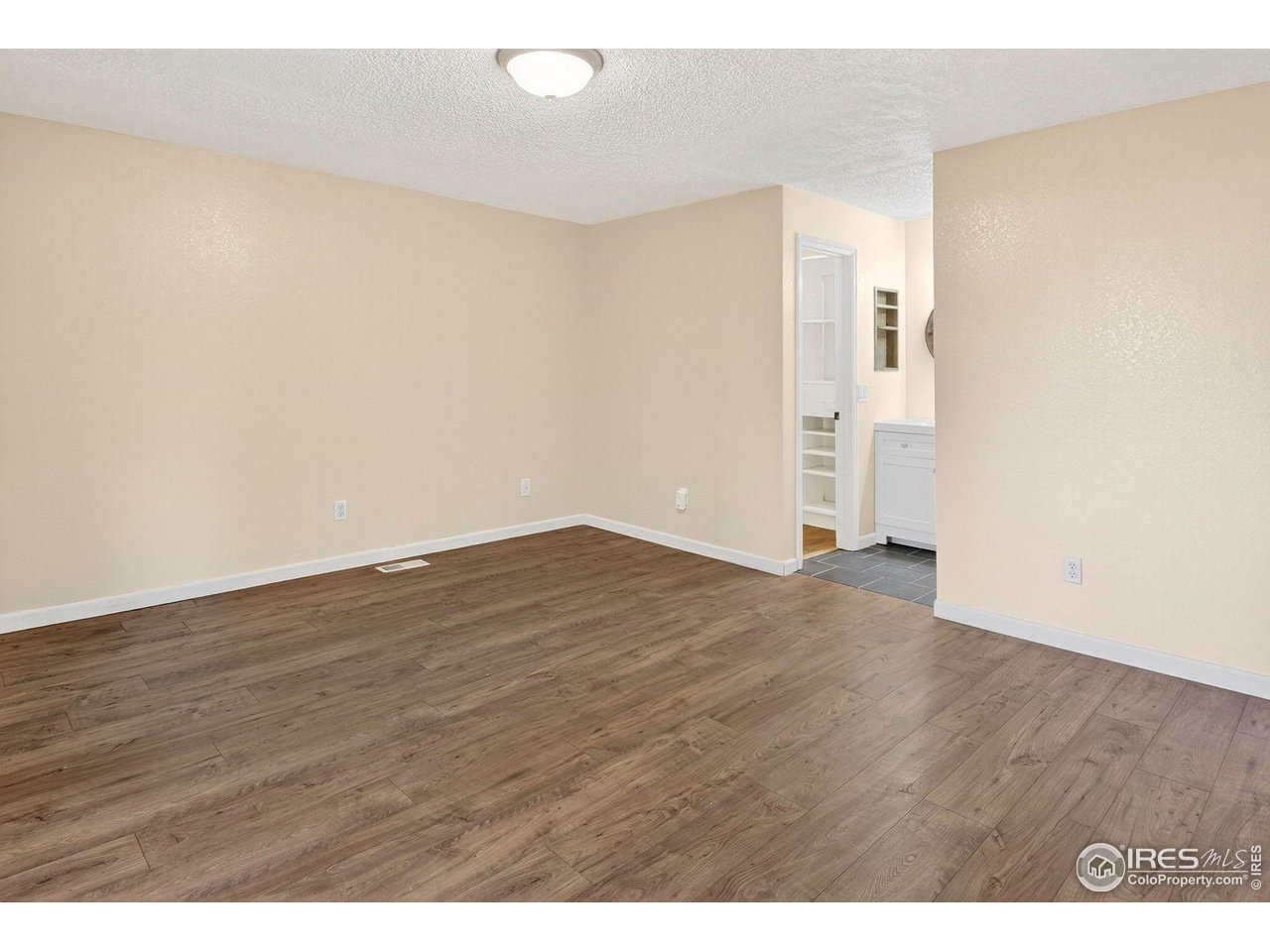 9407 West 89th Circle Broomfield, CO 80021 - Photo 17 of 32 a view of empty room with wooden floor