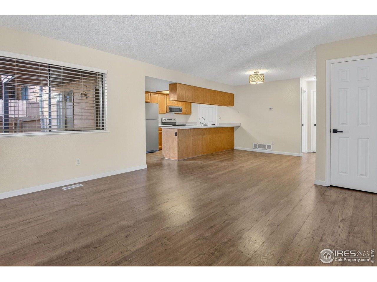 9407 West 89th Circle Broomfield, CO 80021 - Photo 3 of 32 a view interior of a house wooden floor and windows