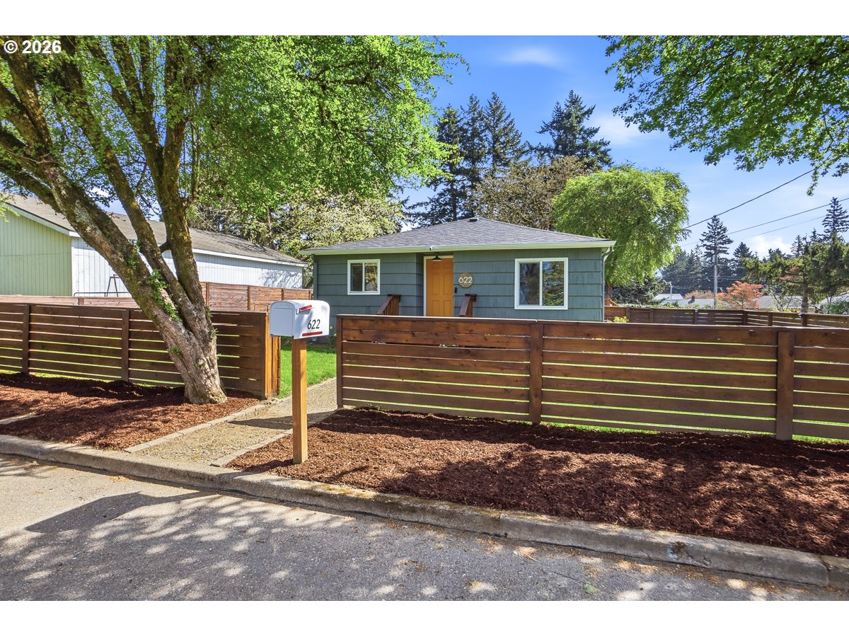 622 Southeast 111th Avenue Portland, OR 97216 - Photo 2 of 34 a view of a house with a yard and tree s