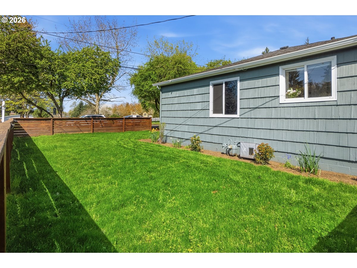 622 Southeast 111th Avenue Portland, OR 97216 - Photo 21 of 34 a front view of a house with a yard