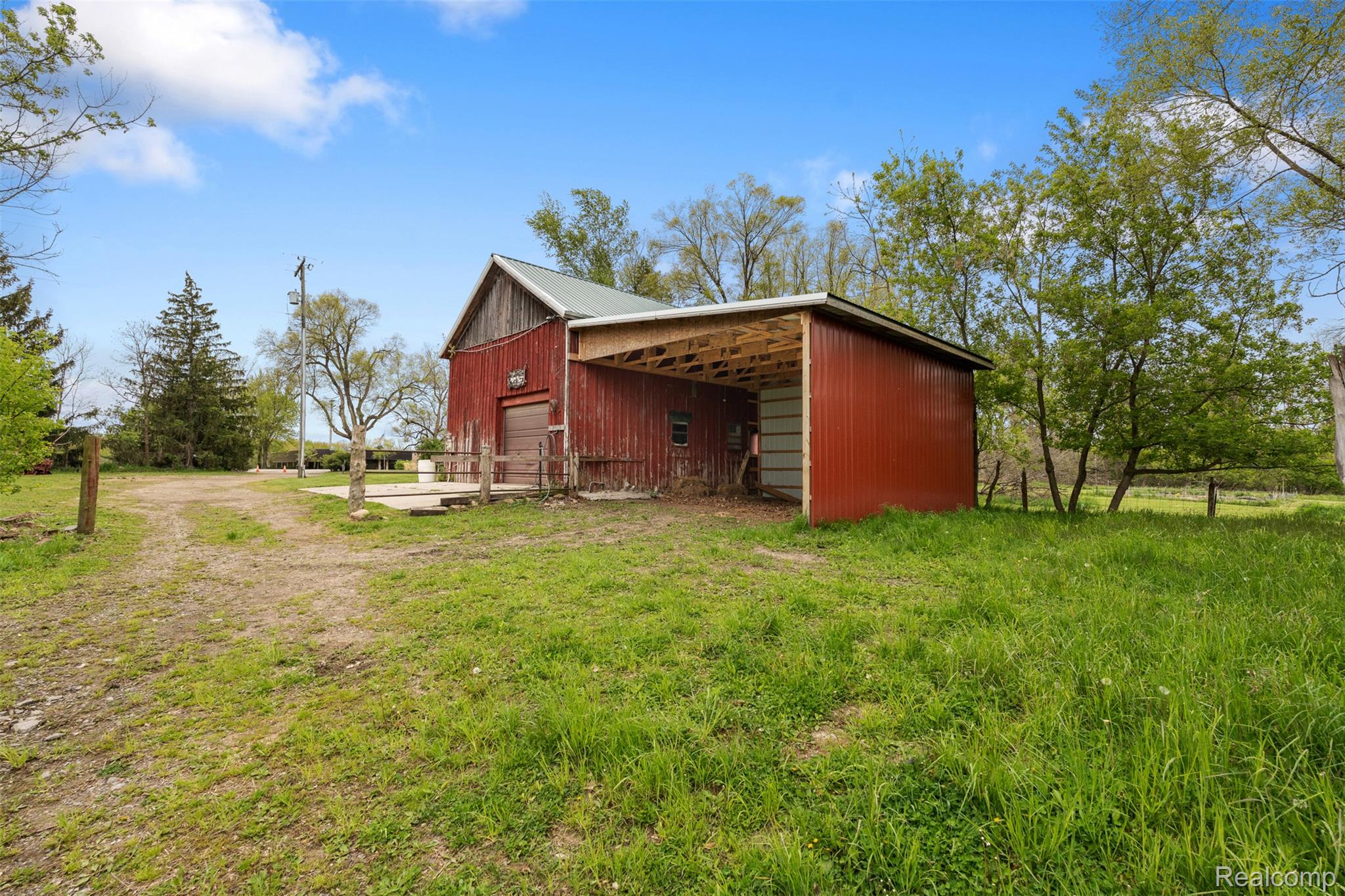 1775 Imlay City Road Lapeer, MI 48446 - Photo 42 of 60 View of pole building featuring a lawn and driveway