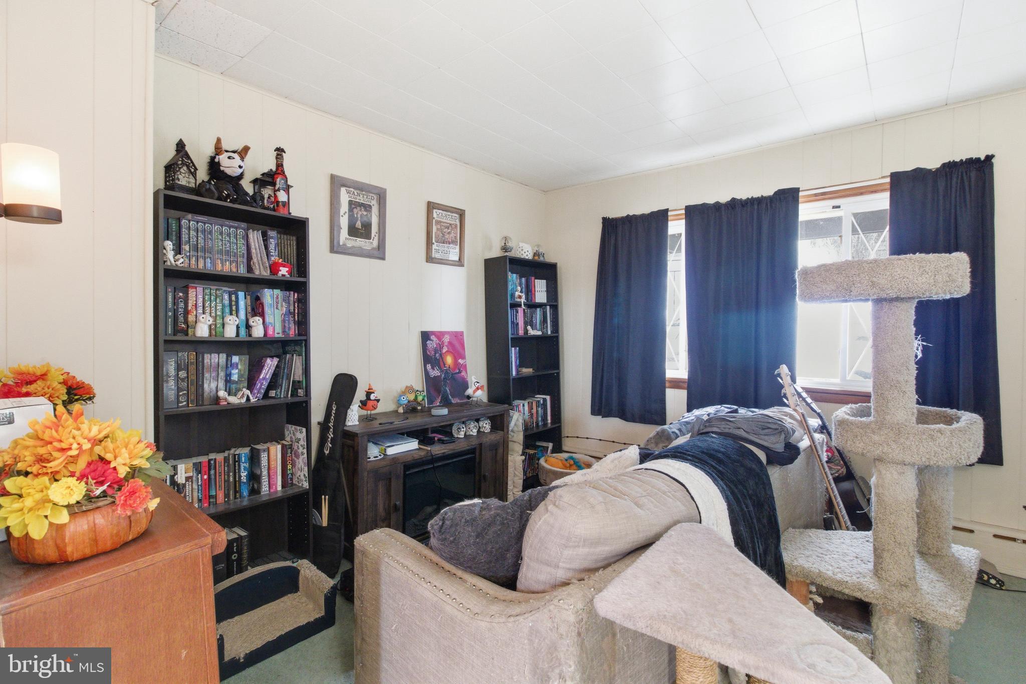 624 Decatur Street Philipsburg, PA 16866 - Photo 13 of 19 a bedroom with bed and a bookshelf