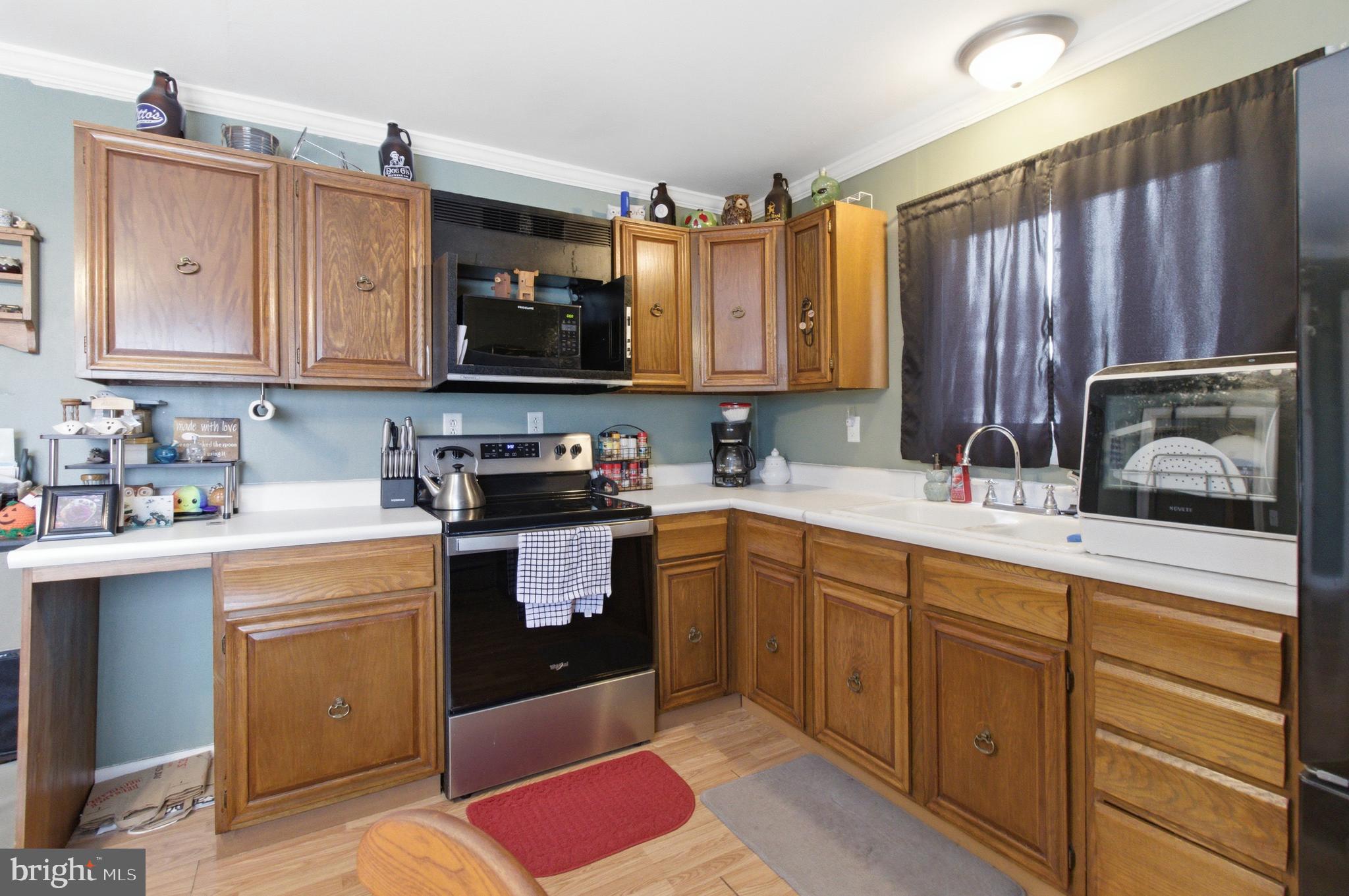 624 Decatur Street Philipsburg, PA 16866 - Photo 9 of 19 a kitchen with granite countertop a sink stainless steel appliances and cabinets