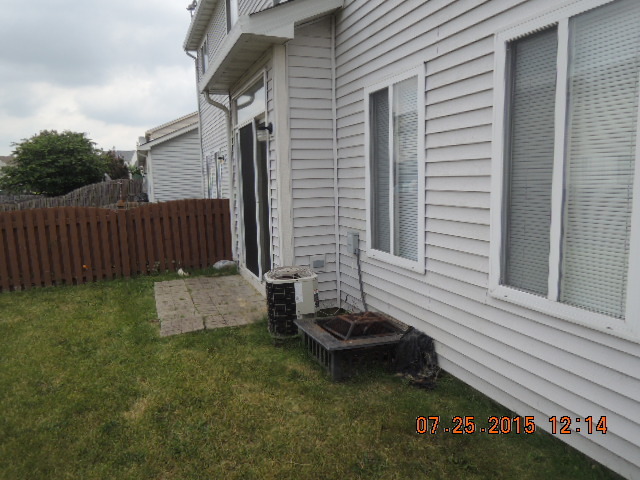 315 Reston Circle Romeoville, IL 60446 - Photo 14 of 14 a view of a backyard with sitting area