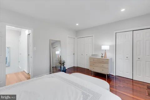 a room with a bed and a mirror