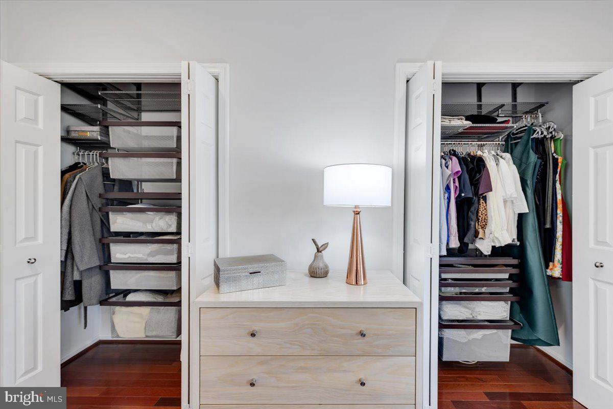 1949 Calvert Street Northwest, Unit E Washington, DC 20009 - Photo 17 of 29 a view of walk in closet with clothes and shoes