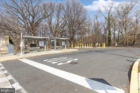a front view of residential houses with yard and trees