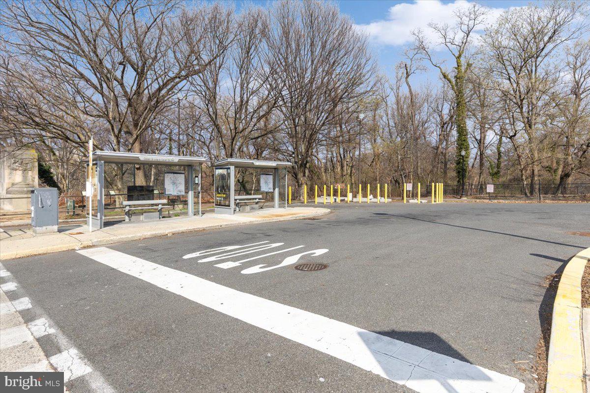 1949 Calvert Street Northwest, Unit E Washington, DC 20009 - Photo 23 of 29 a front view of residential houses with yard and trees