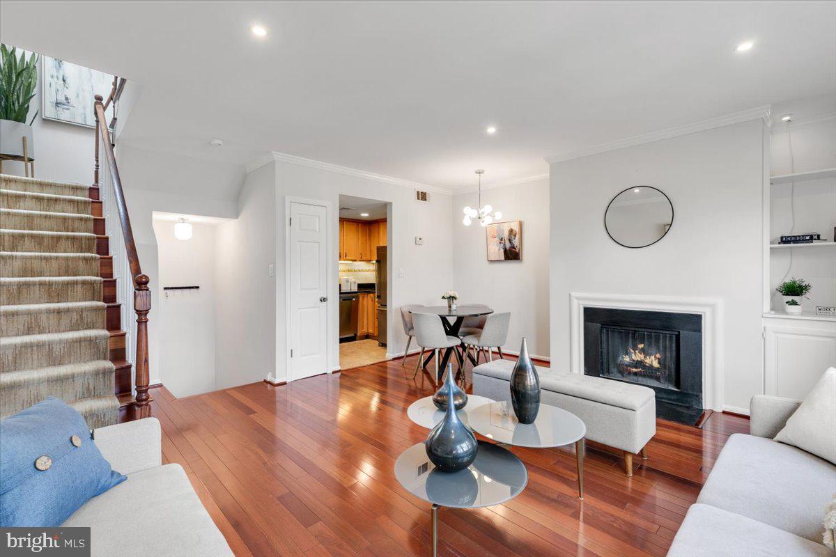 1949 Calvert Street Northwest, Unit E Washington, DC 20009 - Photo 5 of 29 a living room with furniture and a fireplace