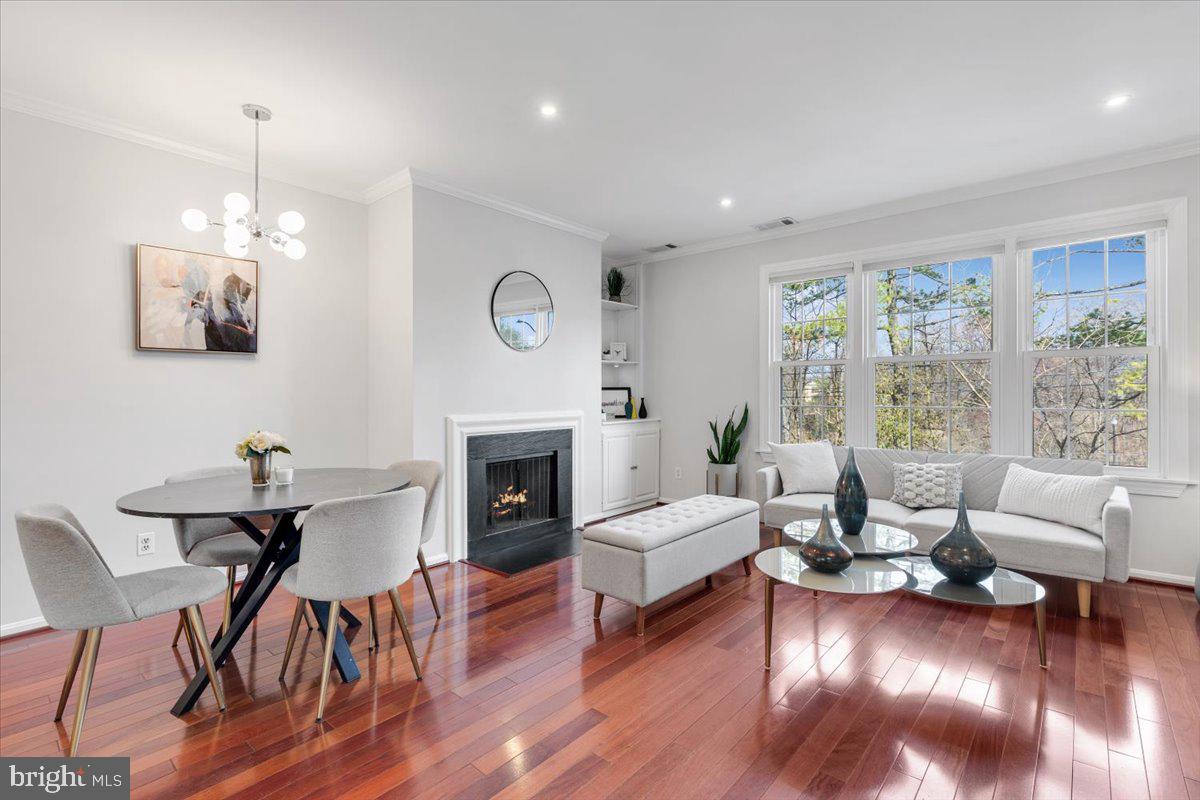 1949 Calvert Street Northwest, Unit E Washington, DC 20009 - Photo 6 of 29 a living room with furniture and a fireplace