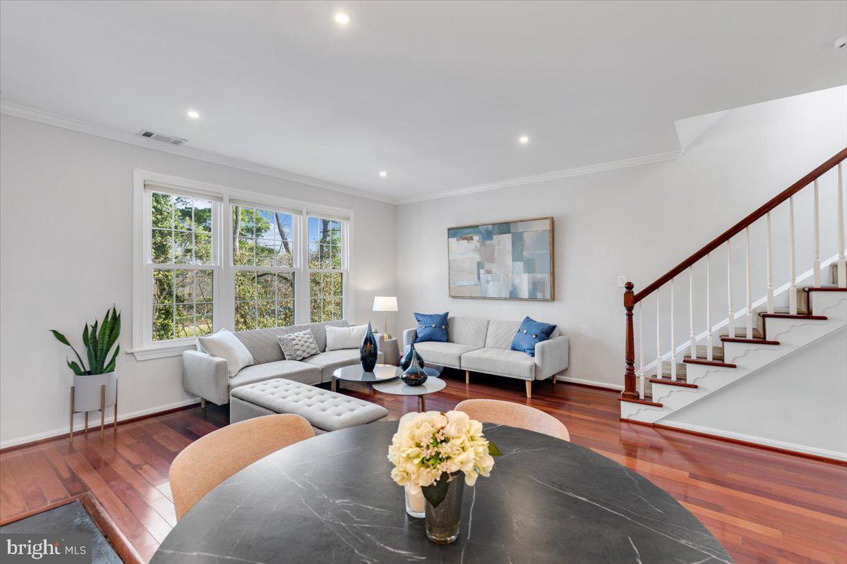 1949 Calvert Street Northwest, Unit E Washington, DC 20009 - Photo 7 of 29 a living room with furniture and wooden floor
