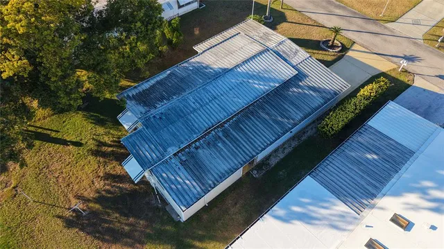 a view of a terrace with furniture and umbrella
