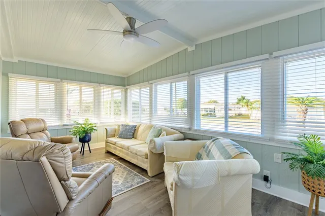a living room with furniture and windows