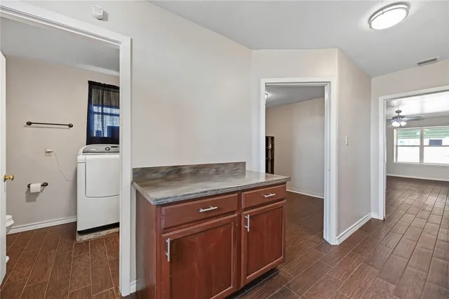 wooden floor with cabinets and wooden floor