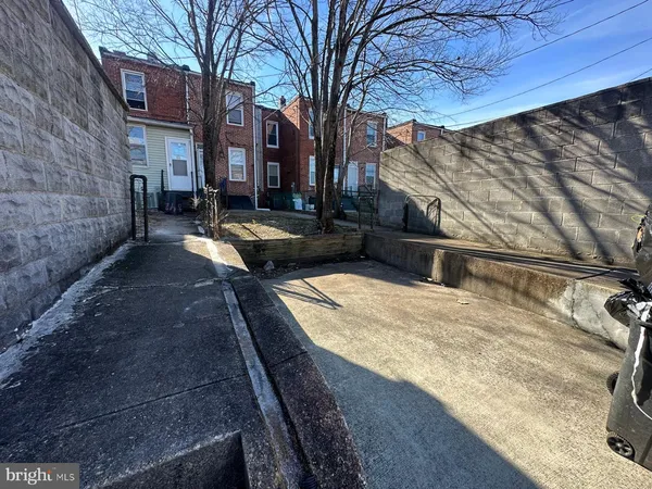 a view of a backyard with a large tree