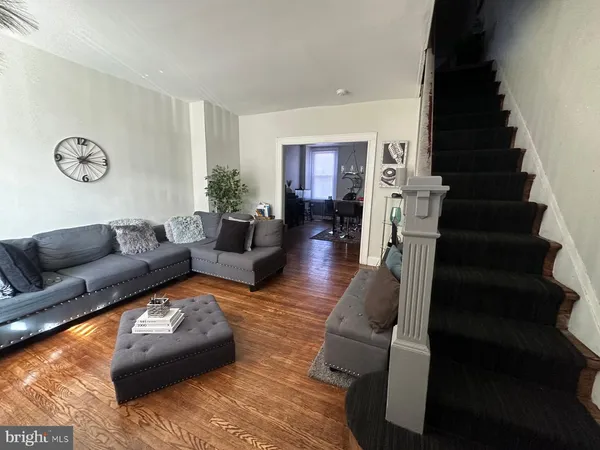 a living room with furniture and a rug