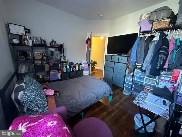 a bed room with furniture and a flat screen tv