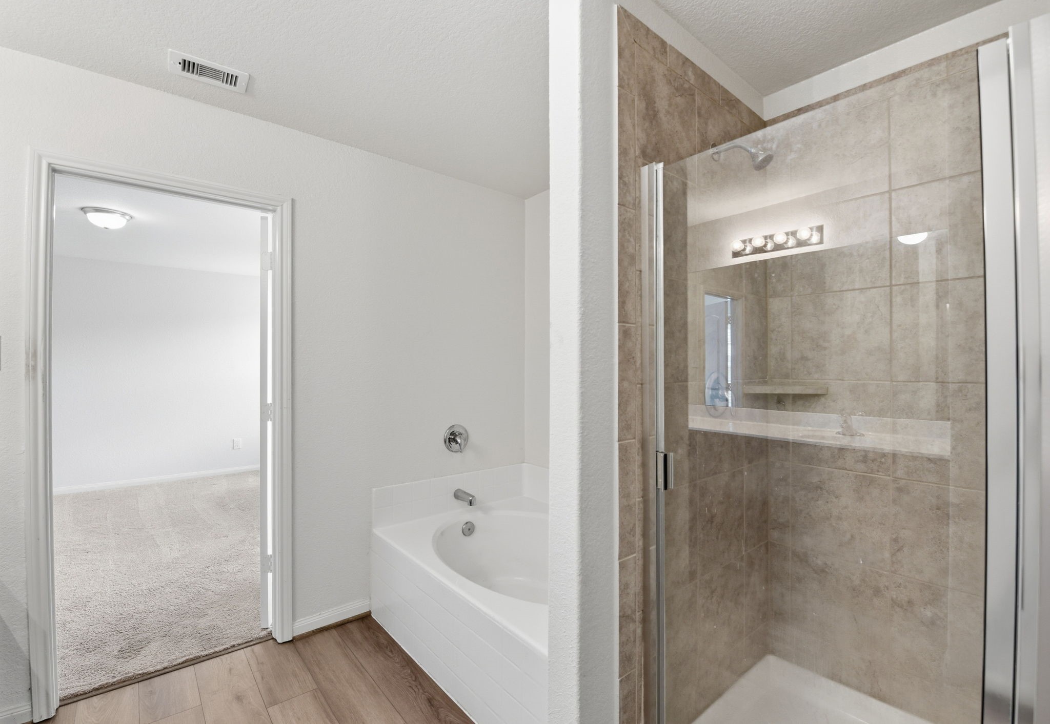 10802 Spring Brook Pass Drive Humble, TX 77396 - Photo 17 of 22 Separate shower/bath in primary bedroom.