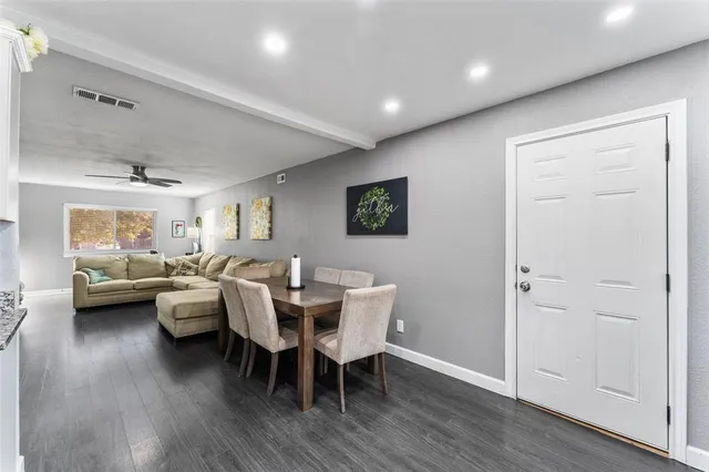a view of a livingroom with furniture and wooden floor