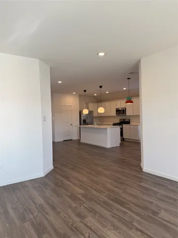 a view of kitchen with wooden floor
