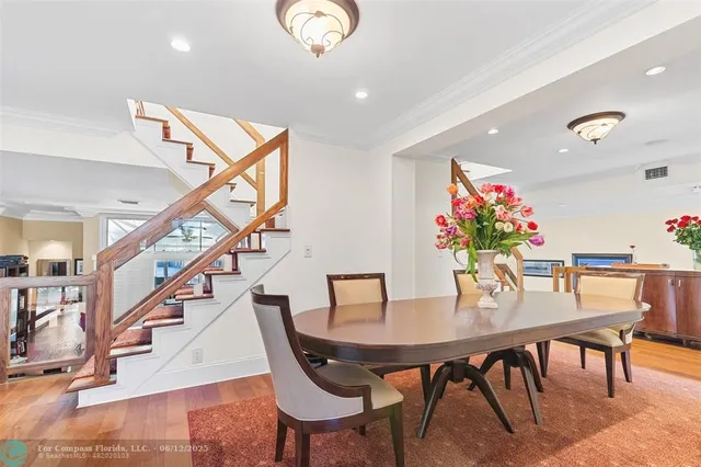 a kitchen with granite countertop stainless steel appliances sink and cabinets