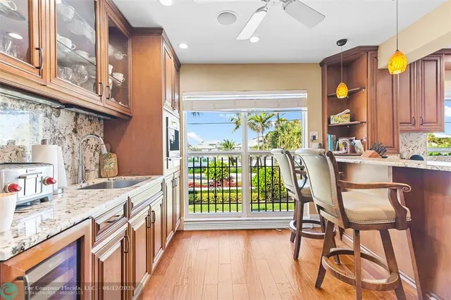 a living room with furniture a rug and a table