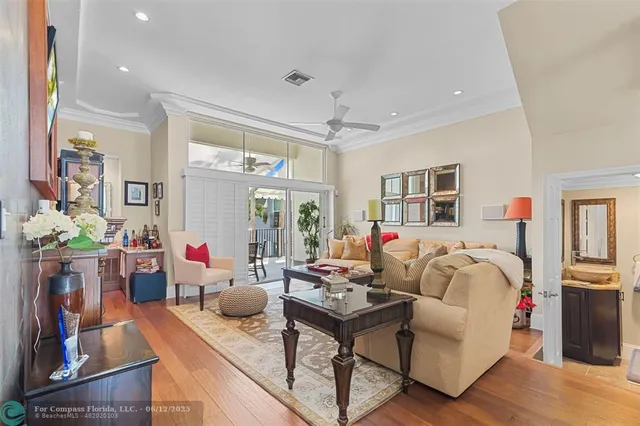 a view of a dining room with furniture and a potted plant