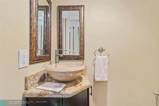 a kitchen with granite countertop a stove and a microwave