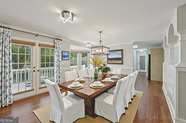 a view of a dining room with furniture window and wooden floor