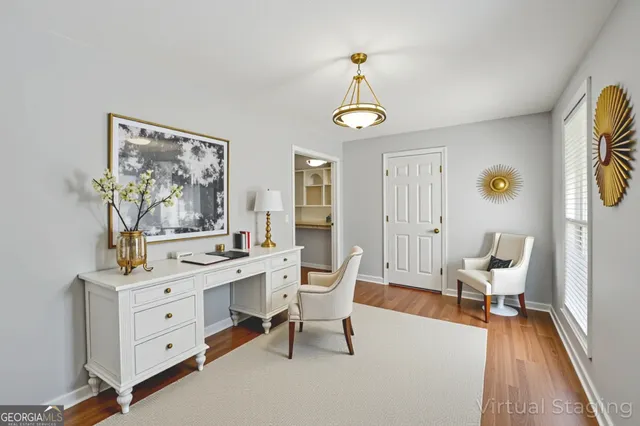 a view of a workspace with furniture